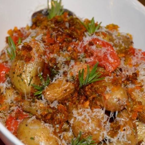 CREOLE L.A. - ROASTED FINGERLING POTATOES, BLISTERED TOMATO, PARMESAN CHEESE